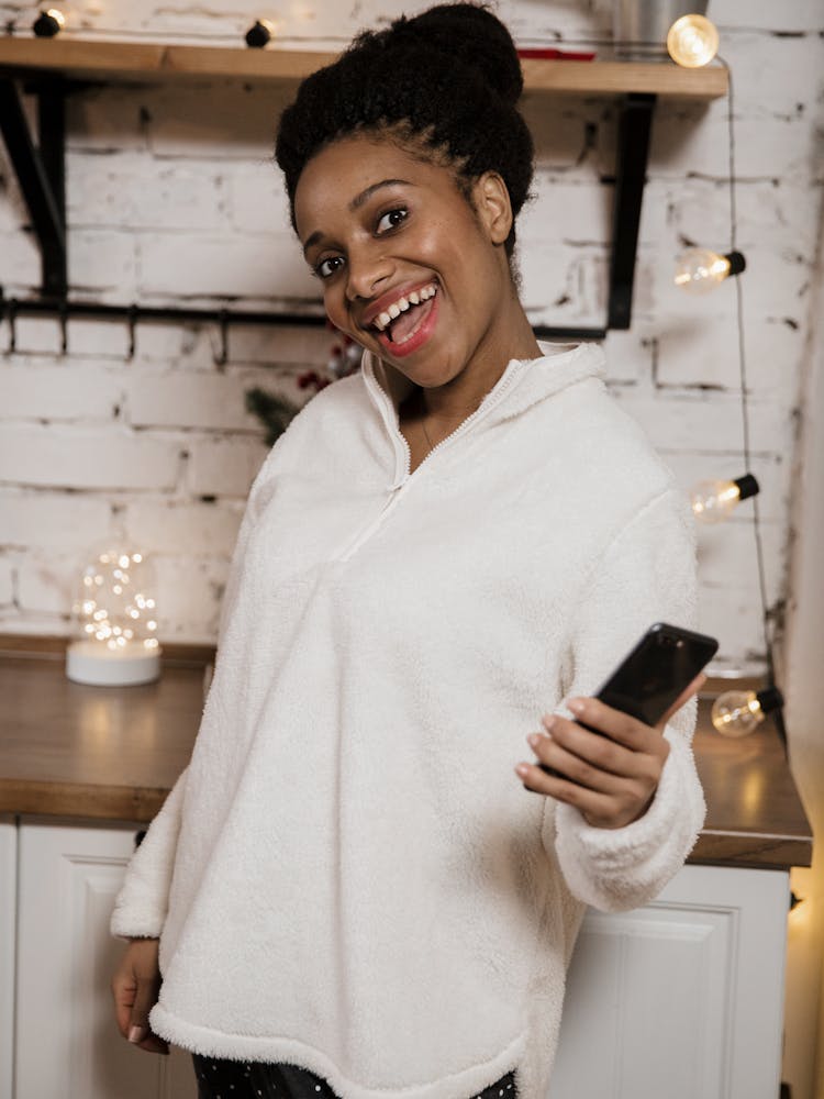 Happy Woman Holding A Phone