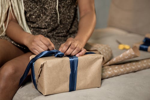 Free Close-Up Shot of a Person Wrapping a Gift Box Stock Photo