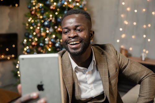 Man in Brown Suit Jacket Smiling