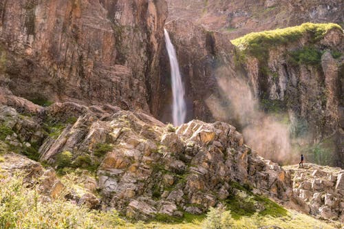 Scenic View of a Waterfall on a Rocky Mountain