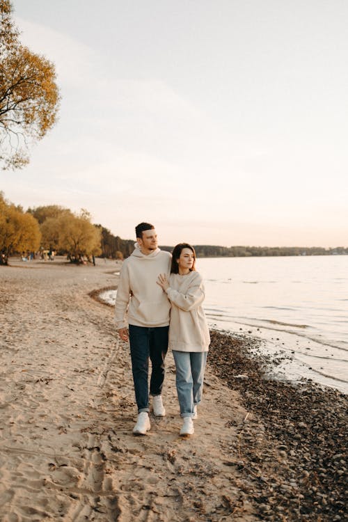 A Couple Walking on the Beach