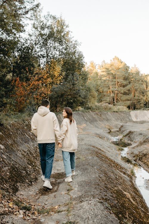 Couple Walking Near a Canal