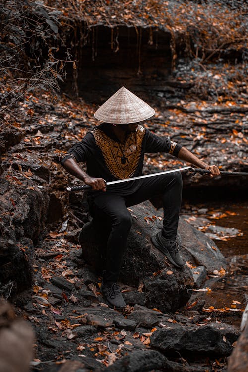 Free A Man Holding a Samurai Stock Photo