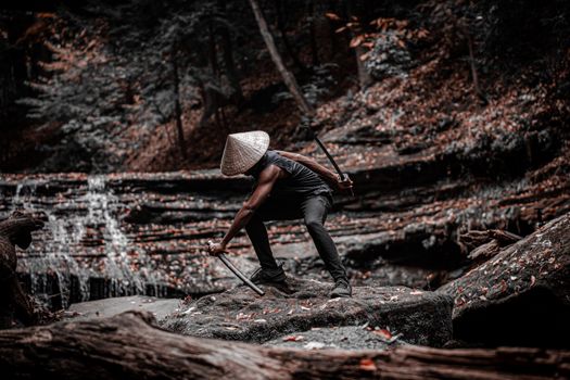 Dramatic scene of a samurai wielding swords on a forest rock, exuding dynamic and intense vibes.