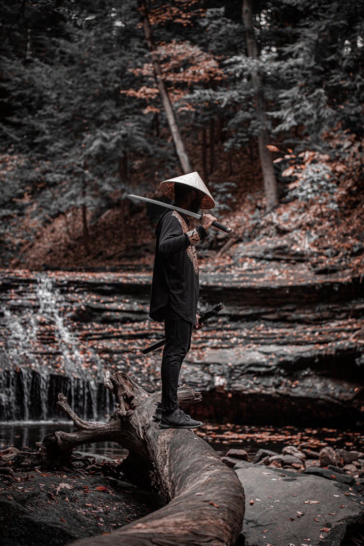 A Man Holding A Samurai