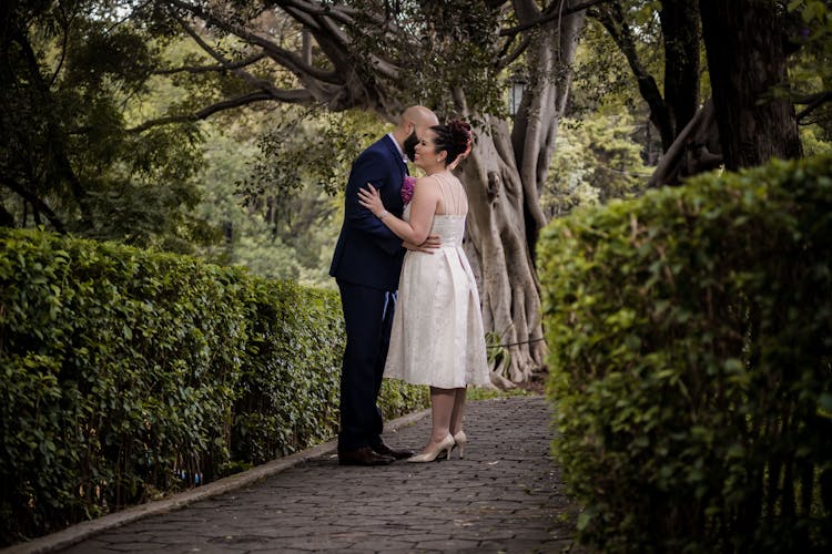 Man Whispering To A Woman