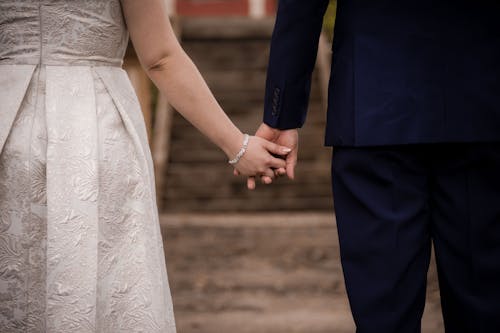 Free Man and Woman Holding Hands Stock Photo