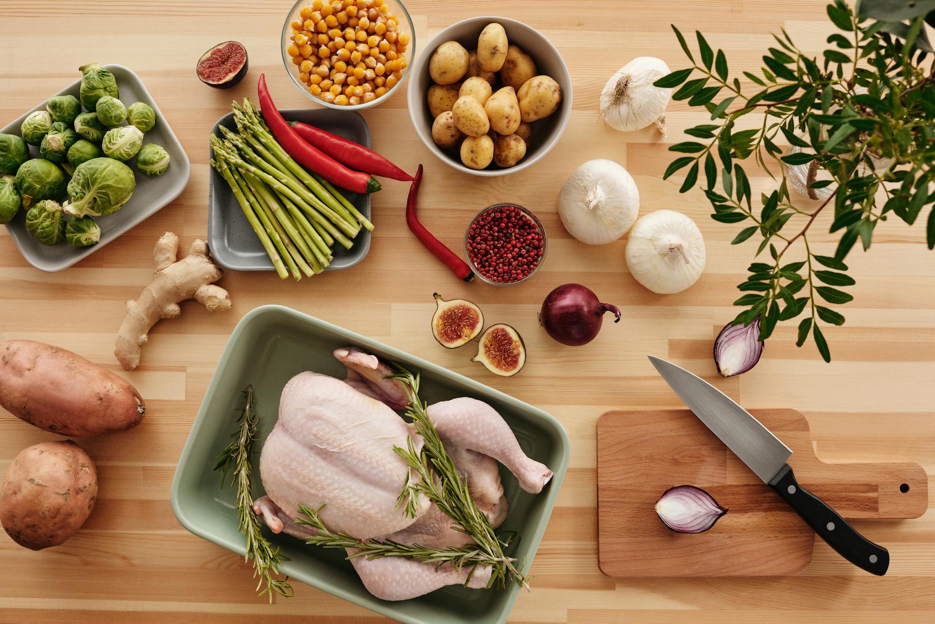 Chicken and Green Leaves on Green Plastic Tray