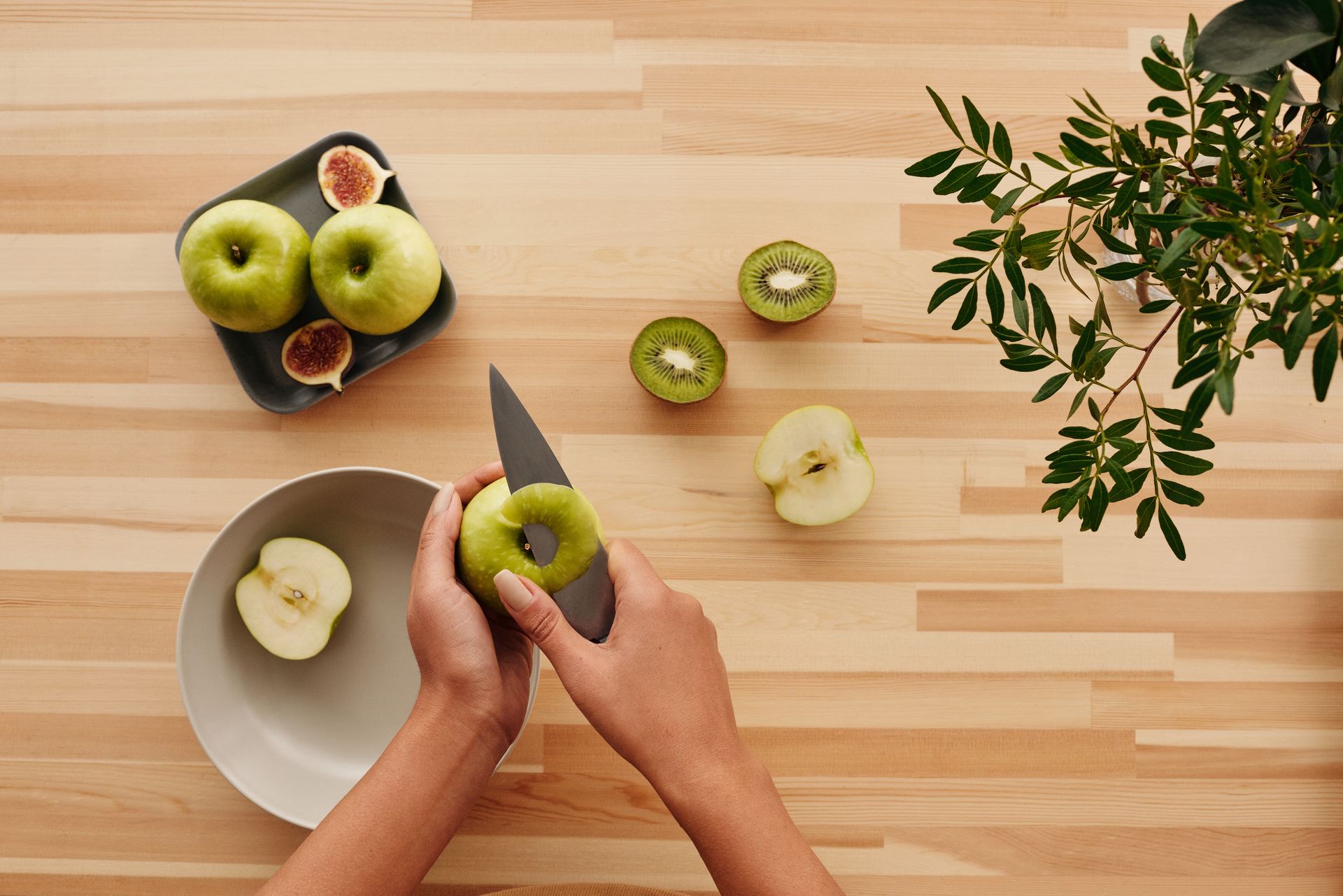 Person Peeling Green Apple