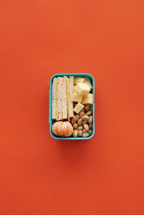 Brown and White Beans in Blue Plastic Container