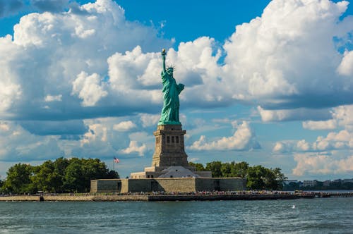 Statue of Liberty against Fluffy White Clouds