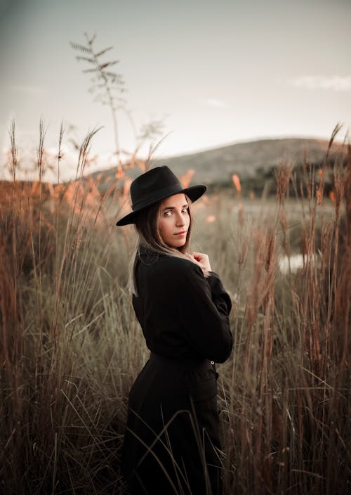 Woman in Black Coat Looking Back