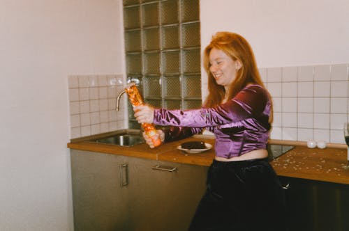 A Woman Wearing Purple Long Sleeves