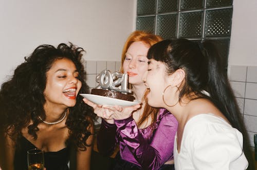 Friend Looking at a Cake Together