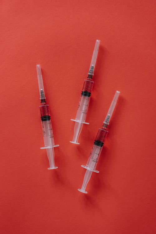 คลังภาพถ่ายฟรี ของ การฉีดวัคซีน, การดูแลสุขภาพ, พื้นหลังสีแดง