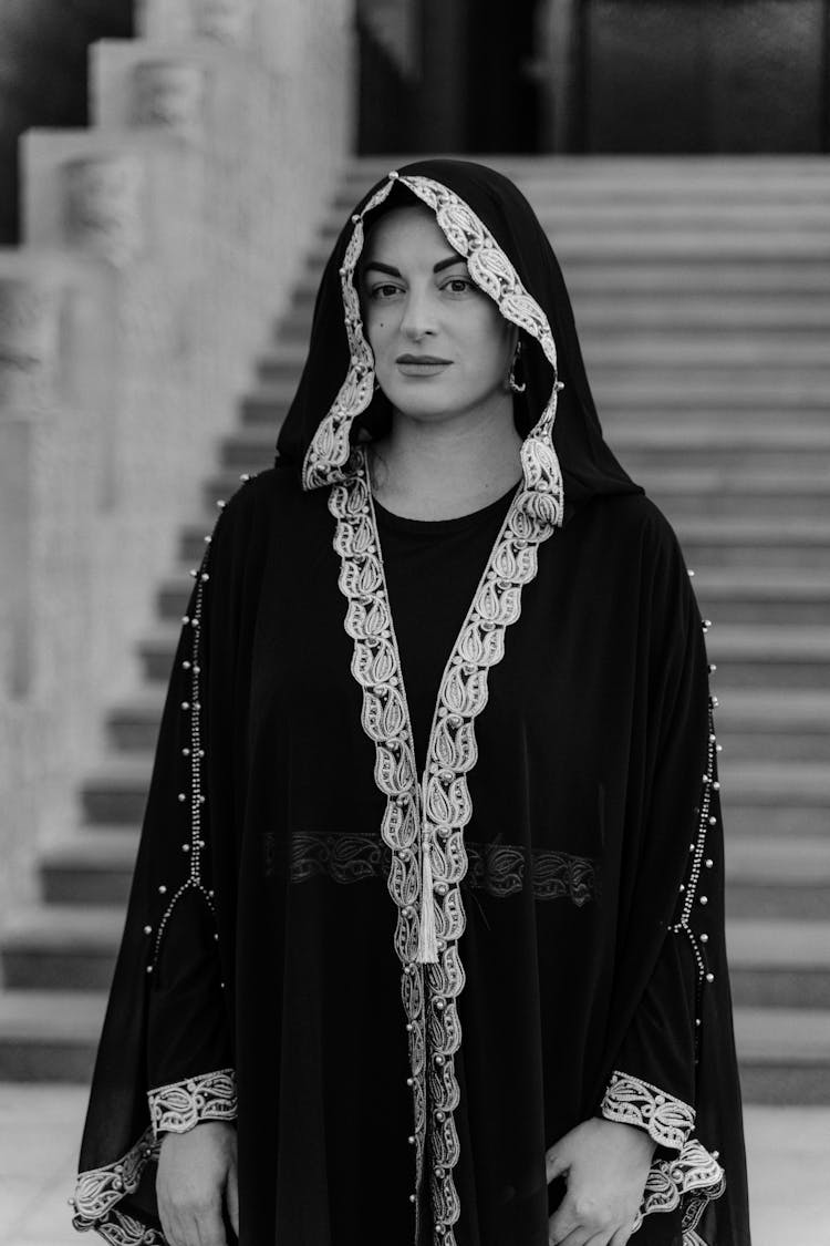 A Grayscale Of A Woman In A Black Robe