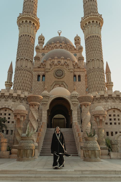 Woman Standing in Front of Al Sahaba Mosque 
