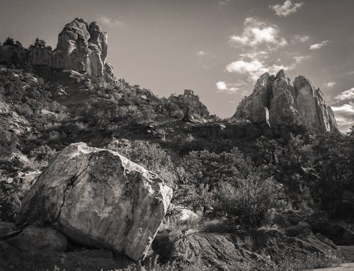 Free A Grayscale of a Mountain with Rock Formations Stock Photo