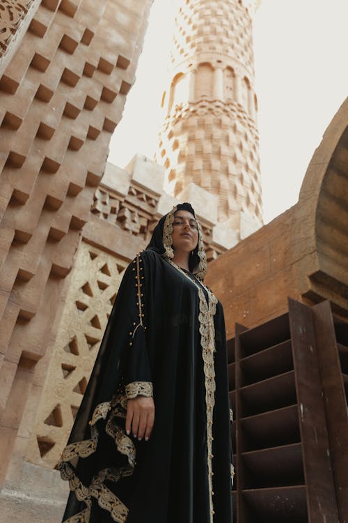 A Woman in Black and Gold Abaya