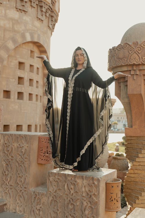 A Woman in Black Abaya Posing at the Camera