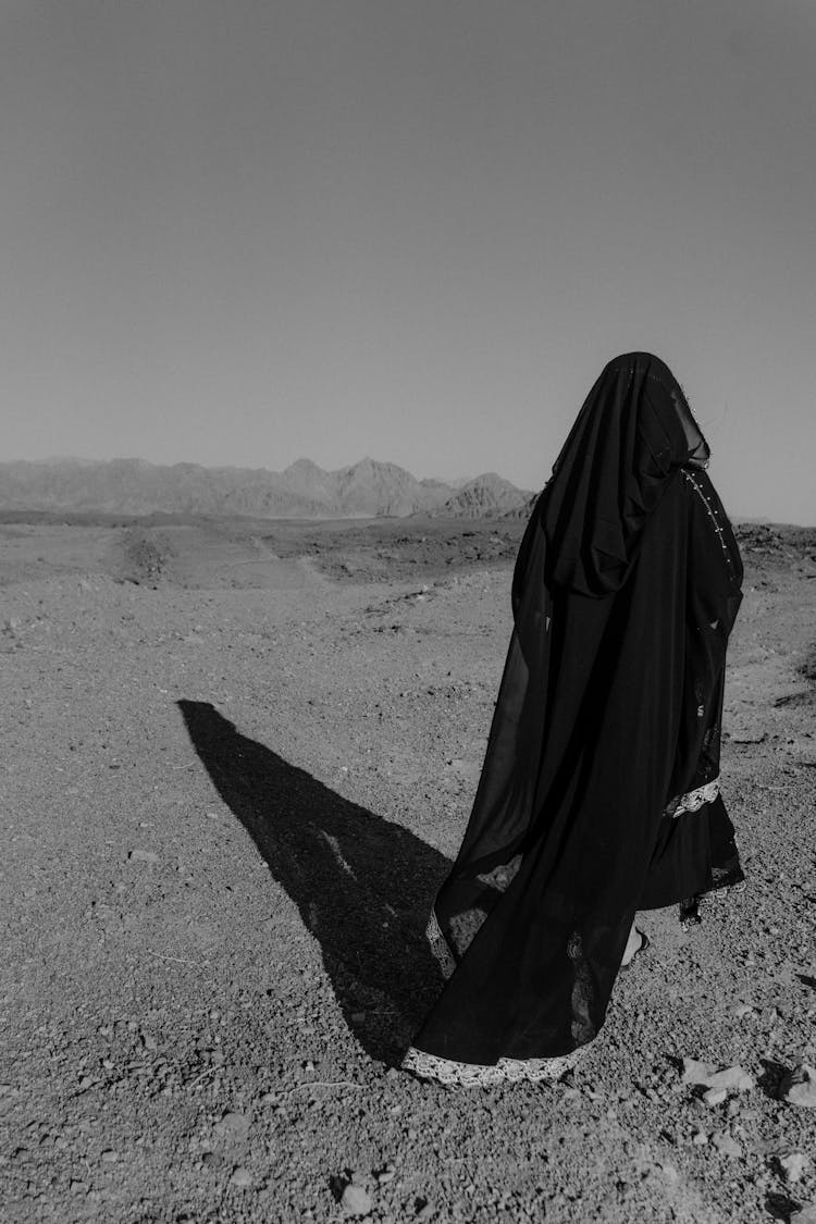 Woman Walking On The Desert