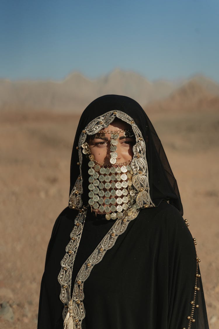 Woman In Black Traditional Dress Looking Away