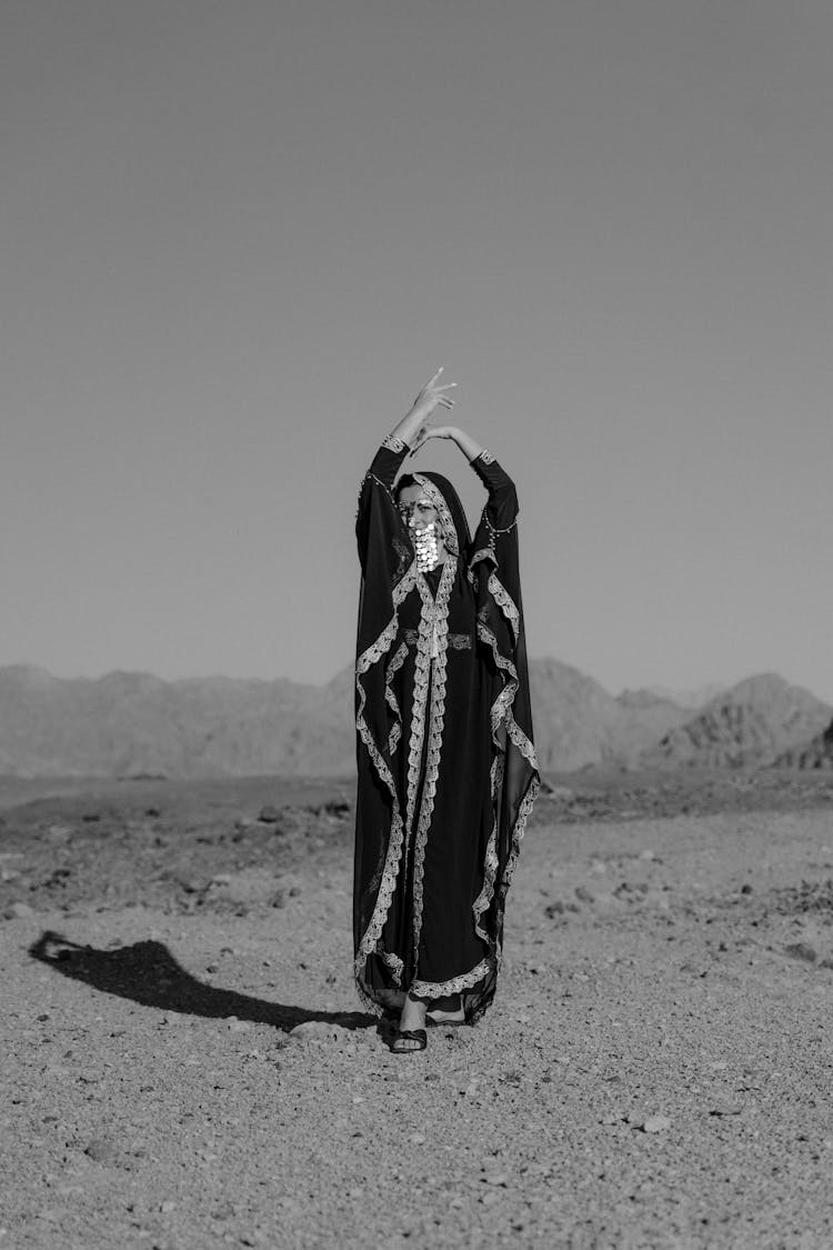 A Woman Dancing On The Desert 