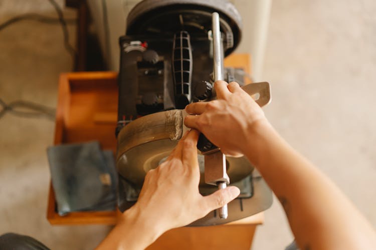 Crop Man Working Sharpening Machine