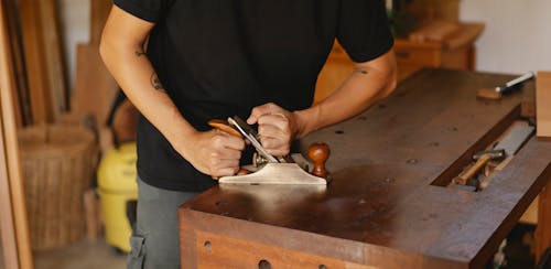Crop master cutting wooden plank