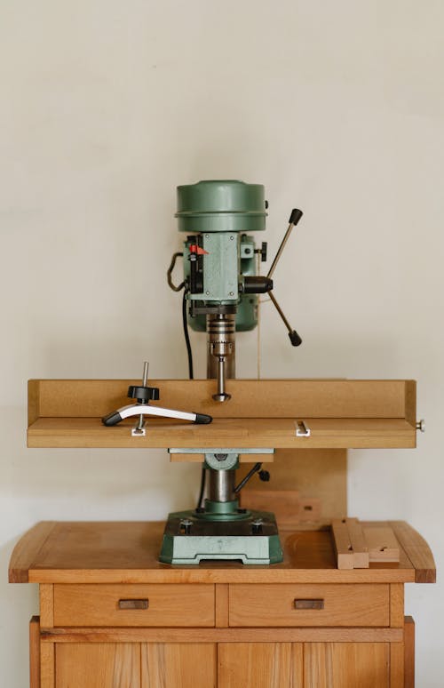 Drilling machine on wooden table