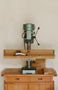 Drilling machine on wooden table