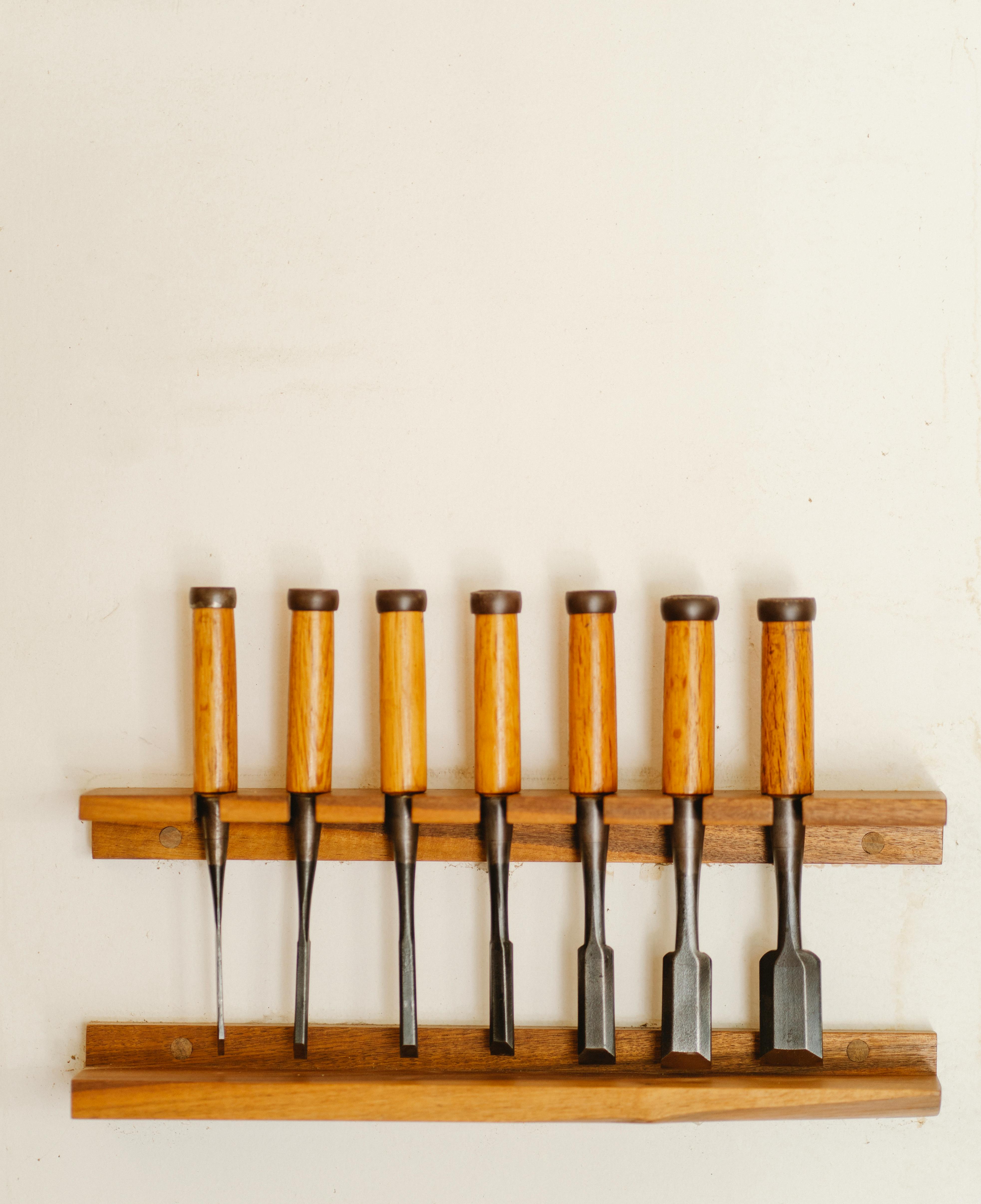 collection of various chisels on wall