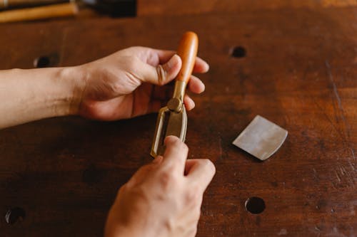 Free Crop artisan with spokeshave in workshop Stock Photo