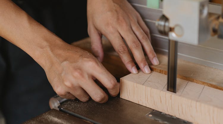 Crop Carpenter Cutting Wooden Block With Band Saw