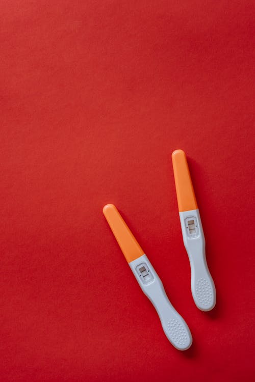 Pregnancy Tests on a Red Surface