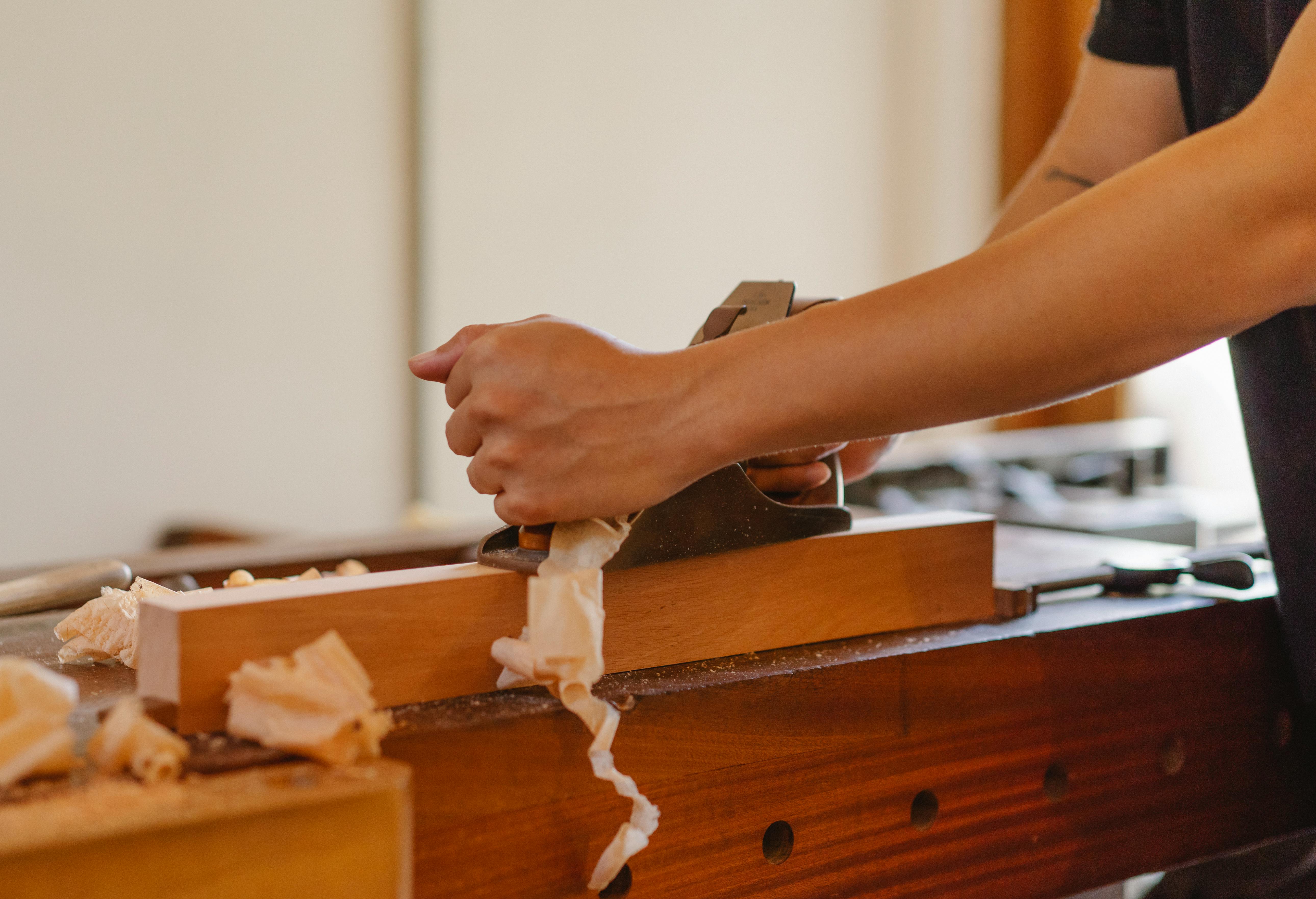 crop woodworker planing hardwood plank