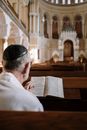 Man in White Dress Shirt Reading Book