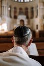 Man in White Dress Shirt Wearing Black Cap