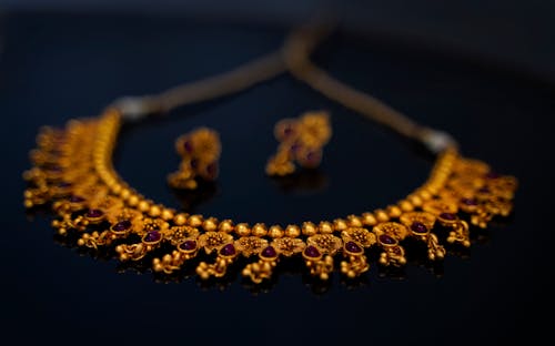 Free A Close-Up Shot of Gold Jewelry Stock Photo