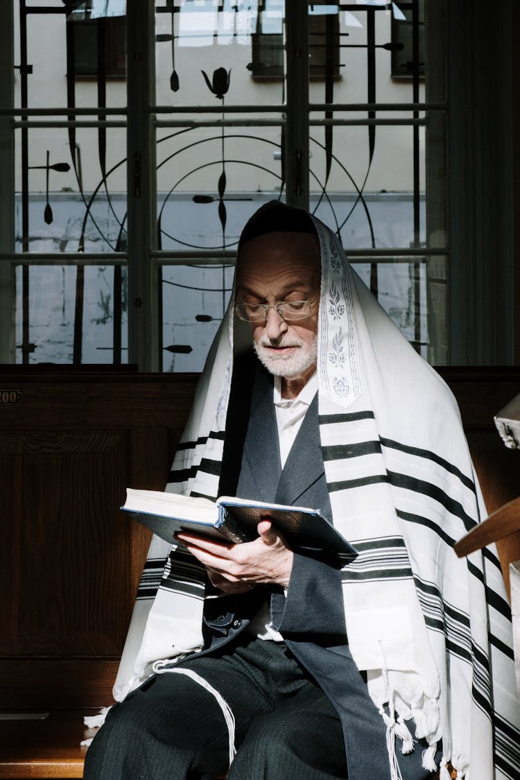 
An Elderly Man Reading A Chumash