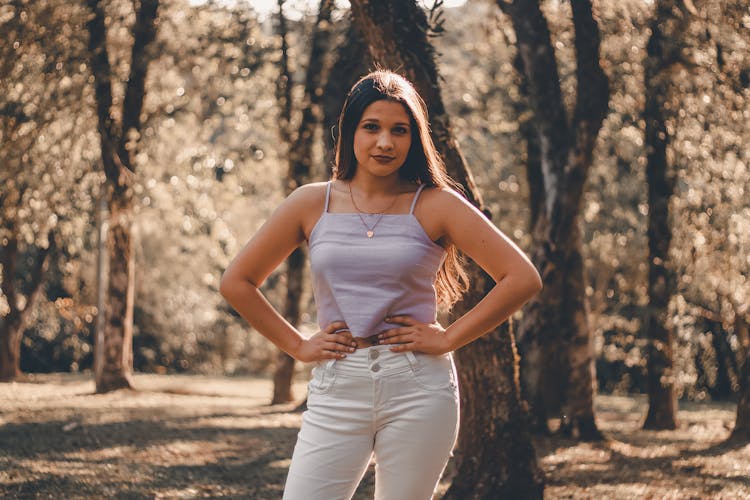 A Woman Posing With Hands On Hips