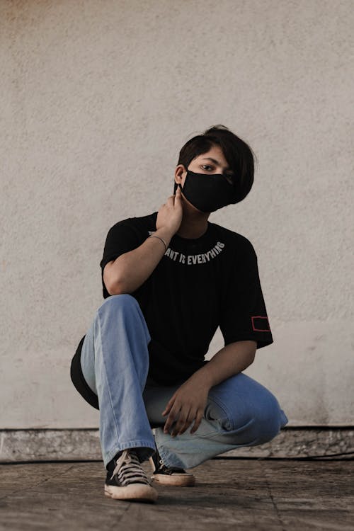 Model Posing in Casual Clothes and Face Mask