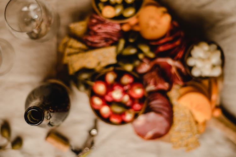 A Bottle Near A Grazing Board