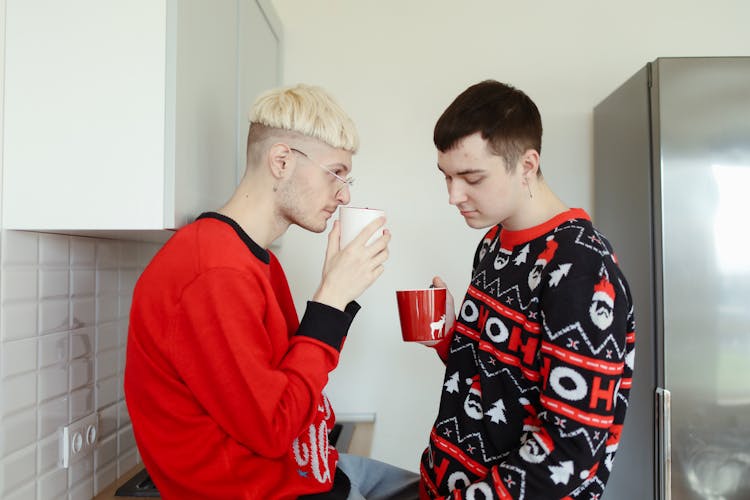 A Couple Wearing Christmas Sweaters