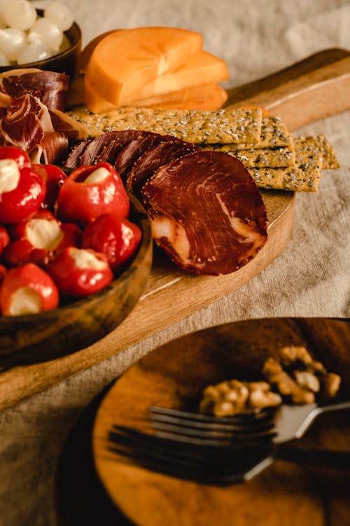 Sliced Ham and Crackers on Brown Wooden Tray 