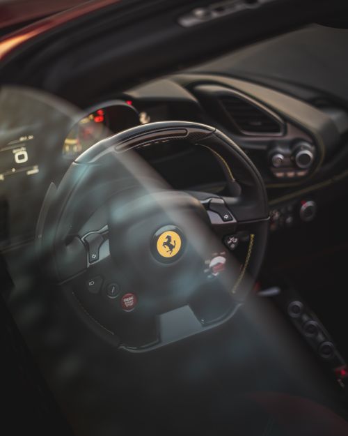 Free Through window of dashboard of prestige automobile with sport steering wheel and speedometer Stock Photo