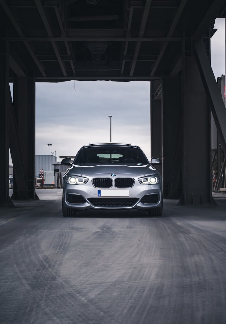 Silver BMW 1 Series Under A Bridge 