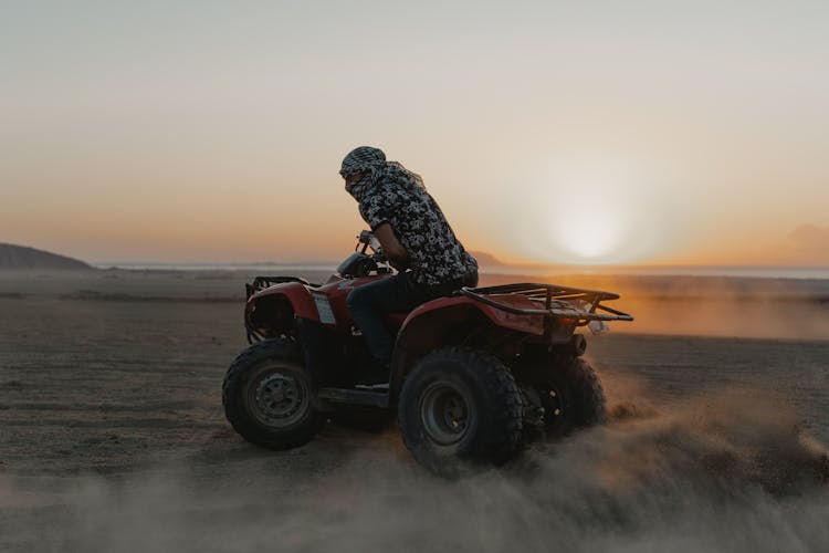 Person Riding Am Atv 