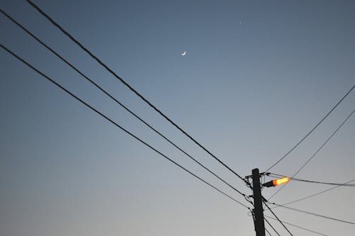  Orang Light on Utility Pole Under the Sky