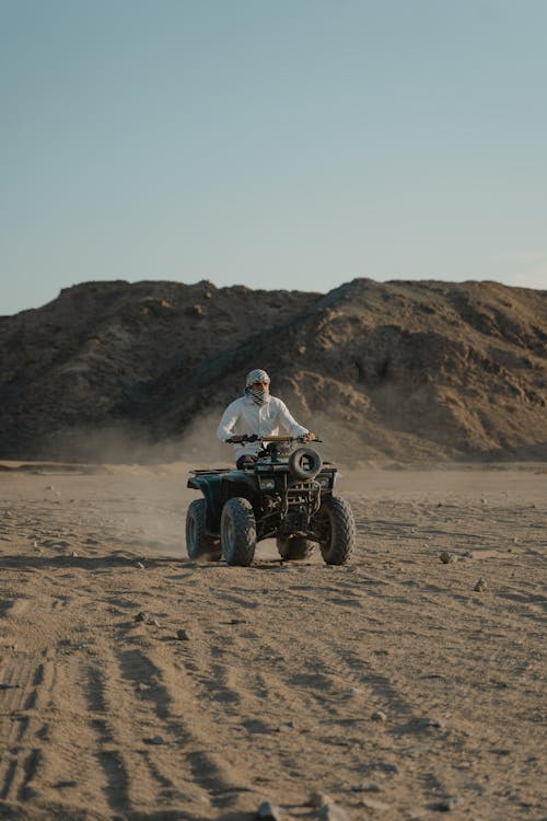 A Man Riding an All Terrain Vehicle